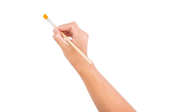 Hand holding a small flat paintbrush with wooden handle, isolated on white background, ideal for painting, art, or craft demonstration