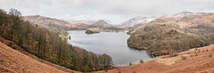 Panorama of Grasmere seen from Loughrigg Terrace with snow covered hills in the background, Lake District, UK