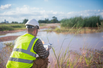An environmental expert is collecting water samples from a natural pond to test the ecosystem for...