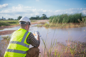 An environmental expert is collecting water samples from a natural pond to test the ecosystem for...