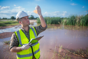 An environmental expert investigates the life in a natural body of water to study its ecosystem.