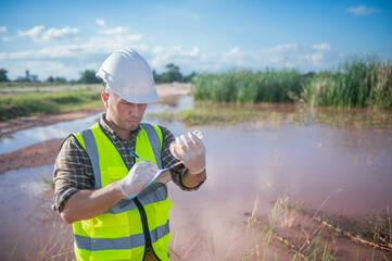 An environmental expert investigates the life in a natural body of water to study its ecosystem.