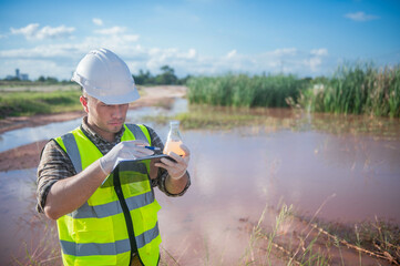 An environmental expert investigates the life in a natural body of water to study its ecosystem.