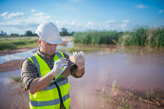 An environmental expert investigates the life in a natural body of water to study its ecosystem.