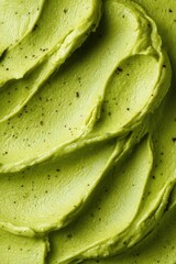 Creamy guacamole texture forming a wavy background