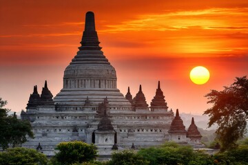 Gawdawpalin temple gleaming during a vibrant orange sunset in bagan, myanmar