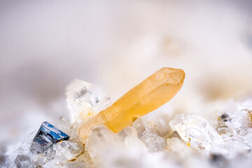 Yellow Synchysite-(Ce) (a rare earth mineral containing Cerium) with black Anatase on Quartz. Specimen from Les crevasses, Jarrier, Alpes, France. Micro photography extreme close-up. 