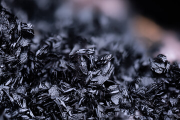 Manganite black crystals. Specimen from N'Chwaning II, South Africa. Micro photography extreme close-up. microscope mineral crystal photography for Scientific use.