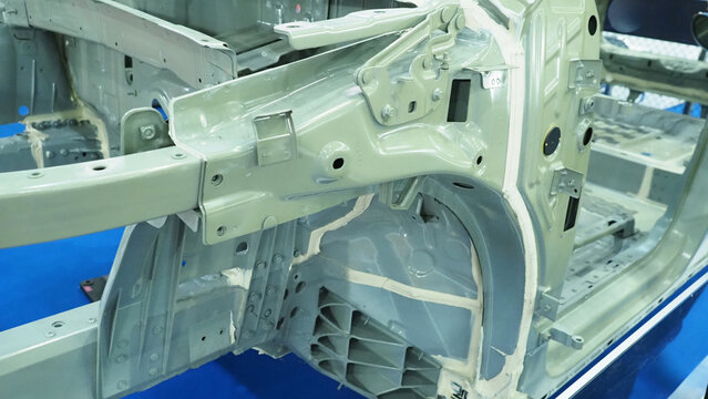 Car body.The interior of a vehicle chassis undergoing seam sealing