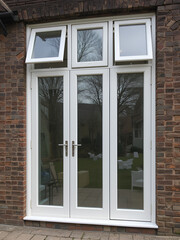 Fototapeta premium Windows with opened casements. White plastic triple doors window isolated.