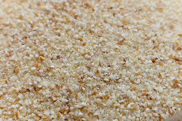 select corn bran, still as good and as select as it is now. macro shot of finely ground cereal, spherhu view. cereal background