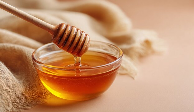 Close-up of honey dripping from wooden dipper