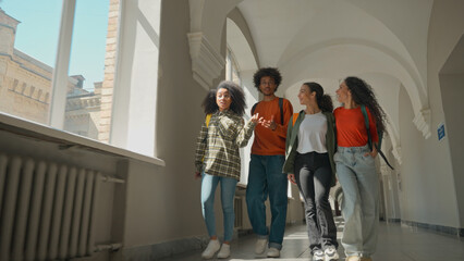 High school classmates walking happy talking communicate conversation multiracial diversity friends students walking in university college bonding talk teenage girls and boy guy speaking in corridor