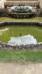 Multi-Tiered Stone Fountain and Pond