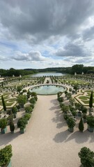 Formal Garden with Circular Pond and Distant Lake