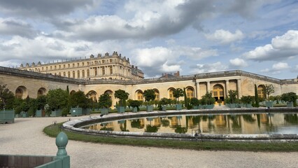 Palace of Versailles Facade with Reflecting Pool and Gardens
