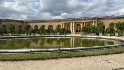 Circular Pond Reflecting Building Facade