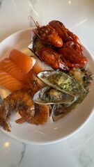 Plate of Seafood with Crawfish, Salmon, Mussels, and Shrimp