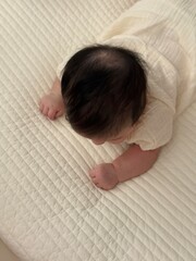 A tiny, chubby baby hand clenched into a fist