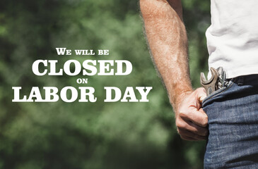 Signboard with the inscription We will be closed on Labor Day. Congratulations for family, loved...