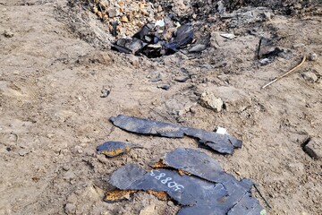 War in Ukraine. Burnt wreckage of Russian drone in Ukrainian city Dnipro. Bombing of civilian population of Ukraine by Russian missiles and drones, explosions.