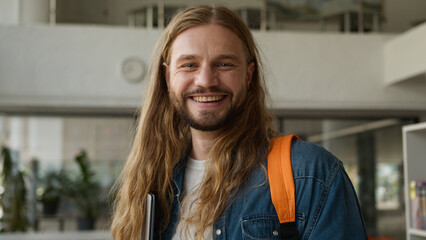 Portrait Caucasian student guy man male positive carefree in university college academy hallway...