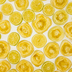 A close up of a bunch of oranges and lemons with the lemons being cut in half. The oranges and lemons are arranged in a way that they look like they are in a basket