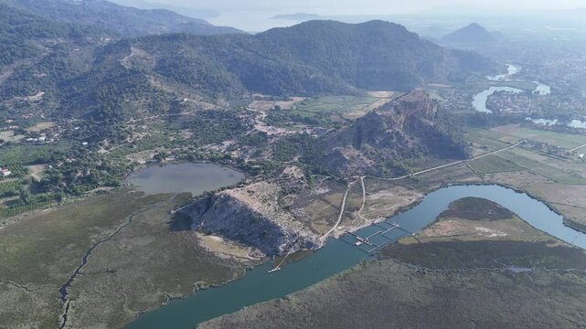 View from acropolis on top of mount to famous ancient Greek city Kaunos in Caria or Caunus in Roman period in Anatolia. Popular place for family travel on summer vacation. Dalyan, Mugla, Turkey