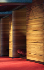 Architectural interior with red plush armchair