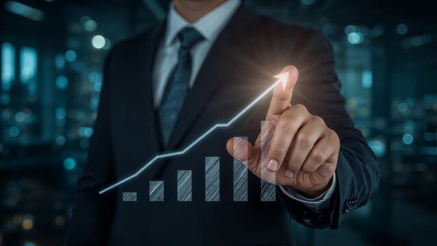 Businessperson points to a rising graph. - Powered by Adobe