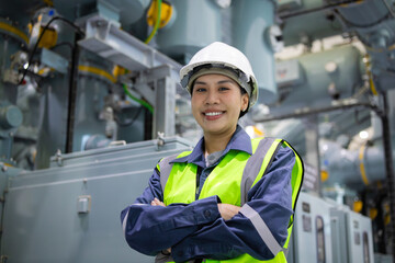 Substation engineer inspects gas insulated switchgear with confidence and safety gear in industrial...