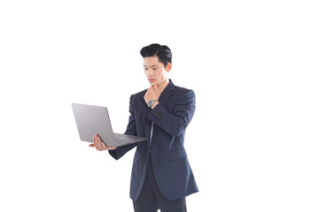 Full-body shot of Asian businessman looking at laptop screen, neutral expression