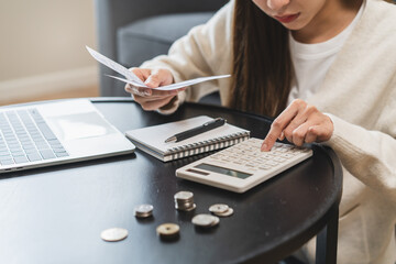Close-up person using a calculator to  plan monthly expense and account