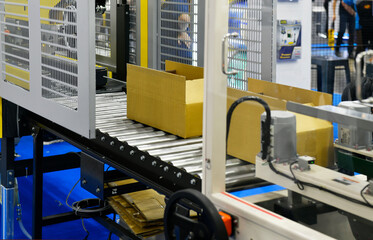 Cardboard boxes on conveyor belt. parcels transportation system concept	