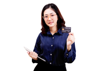 Asian young beautiful woman wearing glasses holds a credit card in one hand and a tablet in the other, dressed in a striped shirt, smiling confidently at the camera.