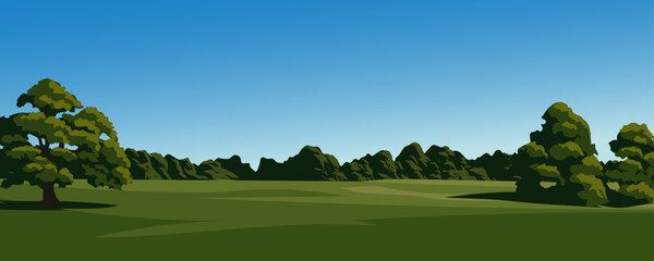 Meadow and forest landscape with clear sky in the background