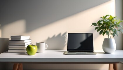 a minimalist desk with a plant in a vase a cup an apple stacked books and a closed laptop in soft natural light
