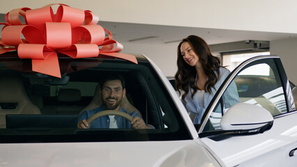 Happy Caucasian family buying new car electric automobile choosing decision carefree talking man...