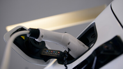 Close up male hand unrecognizable man driver presses on fuel tank cap open plug in charging hose...