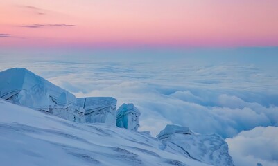 A snowy mountain ridge overlooking a sea of clouds under a pastel colored sky