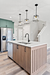 Kitchen with a stainless steel refrigerator, sink, and dishwasher
