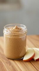 Creamy Peanut Butter in Glass Jar with Apple Slices (1)