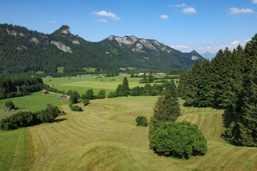 Beautiful landscape view of Füssen region in Germany capturing rolling hills and vibrant greenery...