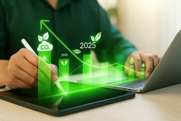 Person is writing on a tablet with a green background that has a graph of CO2
