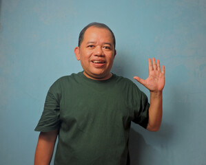 Smiling Man Waving Hand to Say Hello