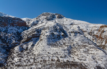 snow covered Amaghu mountain and Gnishik gorge scenic view (Vayots Dzor, Armenia)