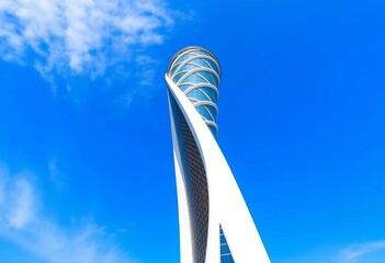 Sleek spiraling tower ascends against vibrant blue sky, modern architecture,  aesthetic,   vertical