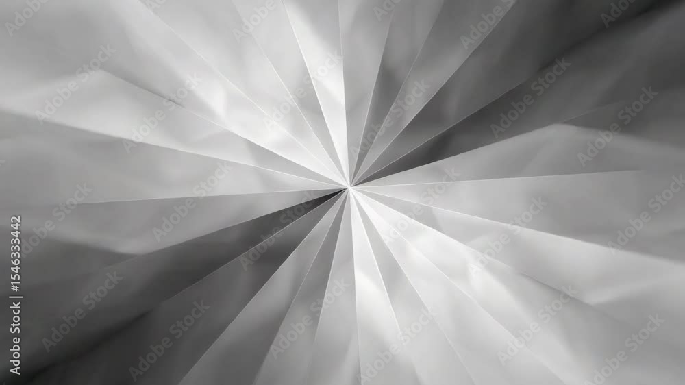 Poster a metallic, geometric abstract pattern radiates from the center, creating a dynamic starburst effect