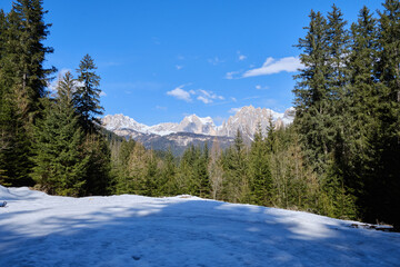 March 2025: Scenic view of snow covered mountains against sky, Fassa Valley.