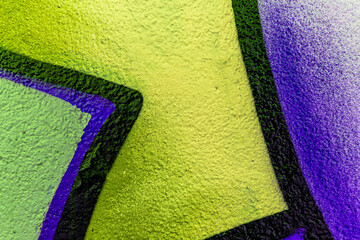 Art under ground. Beautiful street art graffiti background. The wall is decorated with abstract drawings house paint. Modern style urban culture of street youth. Abstract picture on wall